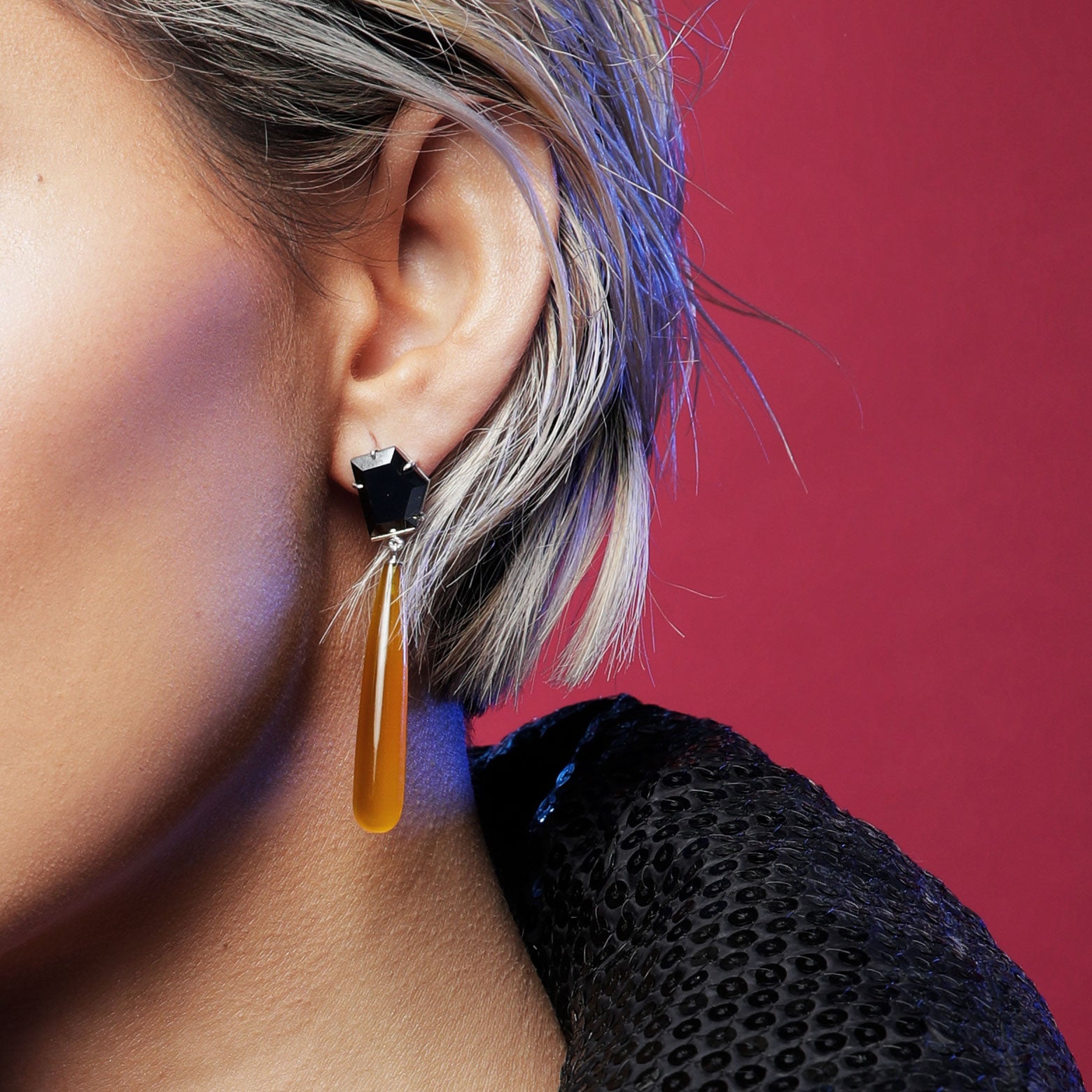 Close up woman wears Hematite and yellow chalcedony earrings