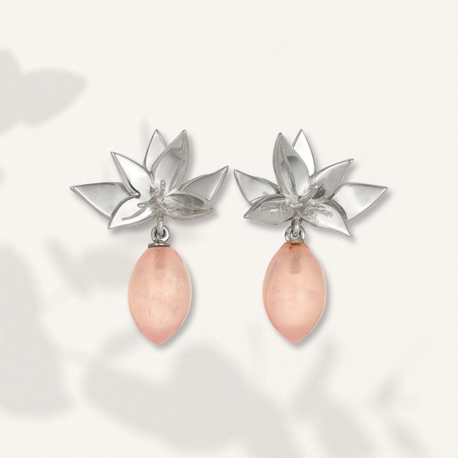 Kelly Woodcroft Brisbane made earrings featuring silver orchids and rose quartz drops. 