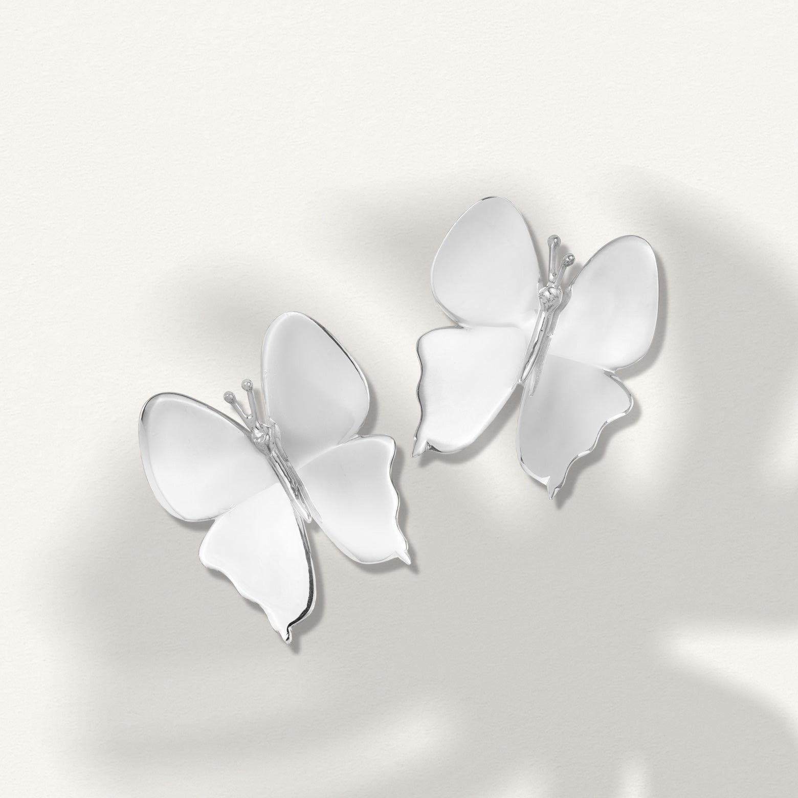 Kelly Woodcroft hand cast silver ulysses butterfly shaped earrings in silver.